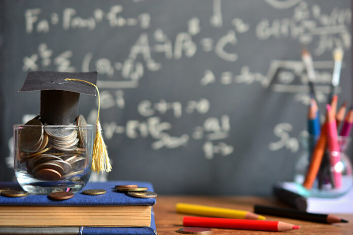 hat graduation model on money coins saving for concept investmen